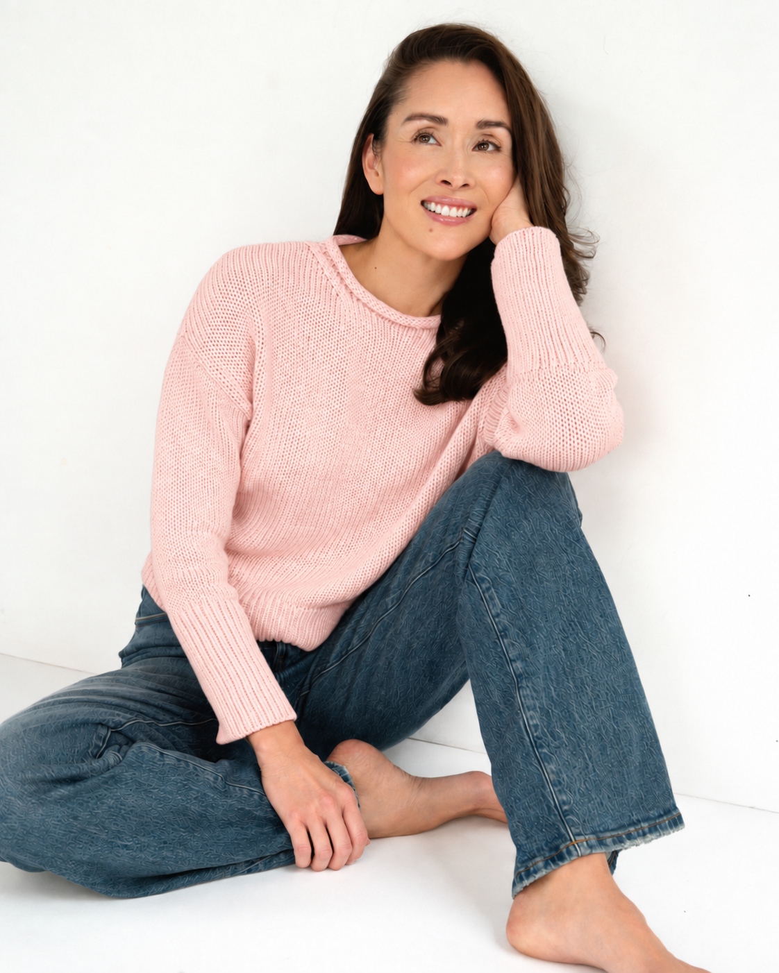 April smiling in a soft pink sweater